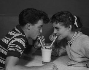 Two teenagers share an Awful Awful ice-cream drink, 1958. (Photo by Bob Barrett/FPG/Hulton Archive/Getty Images)